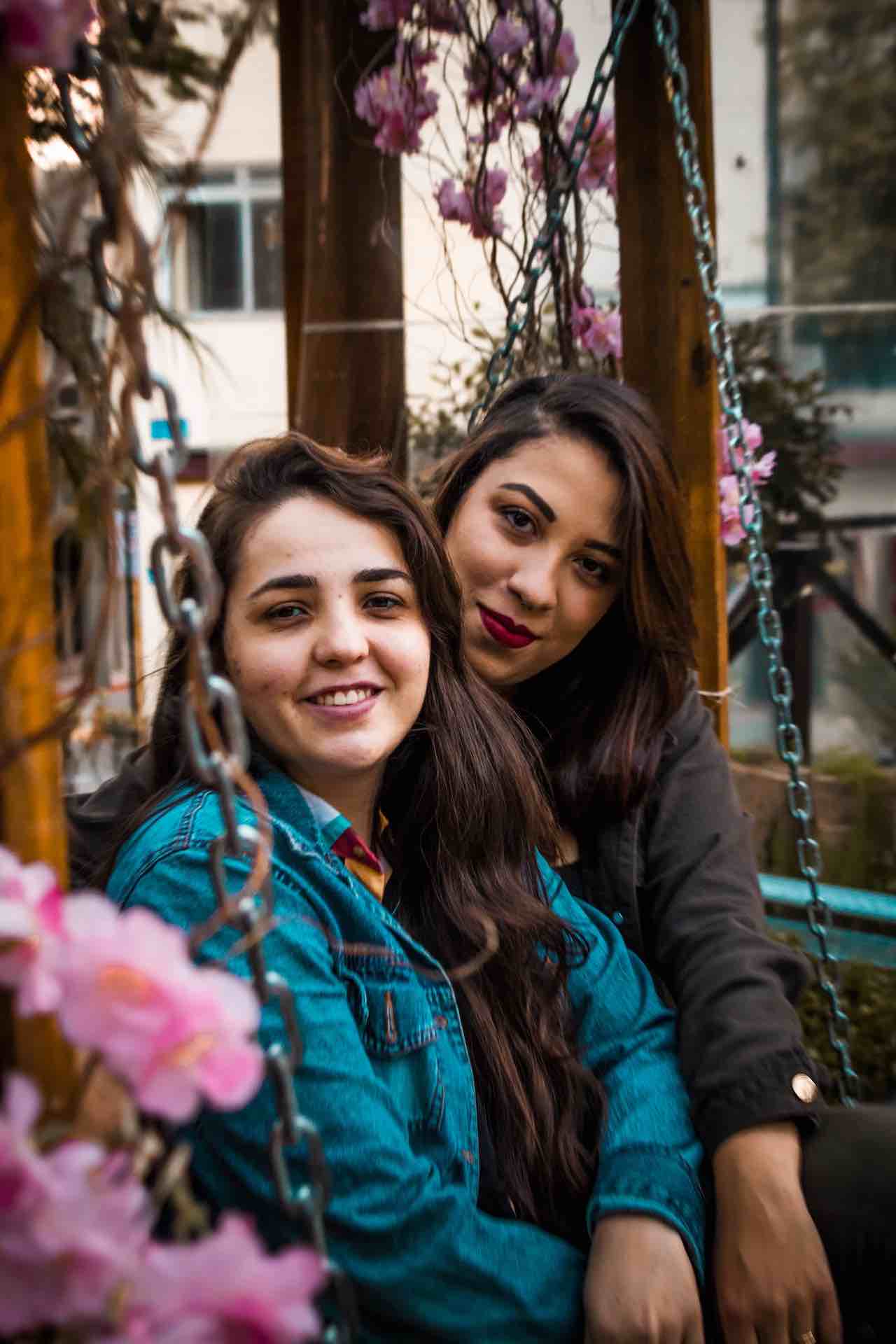 Photo by Felipe Balduino: https://www.pexels.com/photo/two-women-sitting-on-swing-bench-2546959/